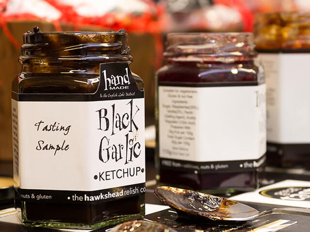 An opened jar of Black Garlic Ketchup at Hawkshead Relish