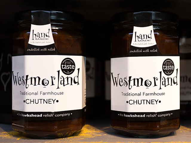 Two jars of Westmorland Chutney on a shelf