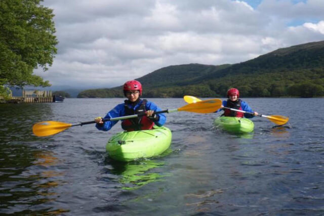 Two people kayaking in an open body of water