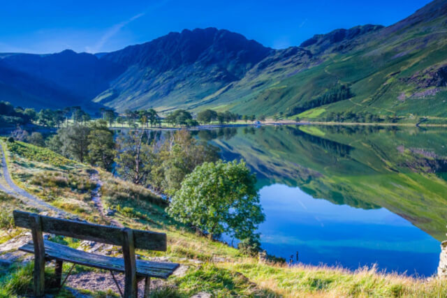 A view across Buttermere from a bench on the green bank