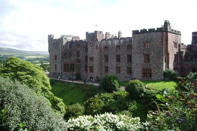 A view from the treetops to Muncaster Castle