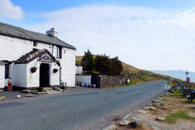 An external shot of the whitewashed building of the Kirktone Pass Inn