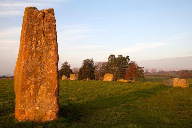 The Long Meg statue made of stone sat on green grass