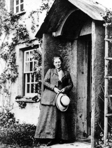 Beatrix Potter at the door of Hill Top, her Lake District home and the setting for many of her delightful children's stories.