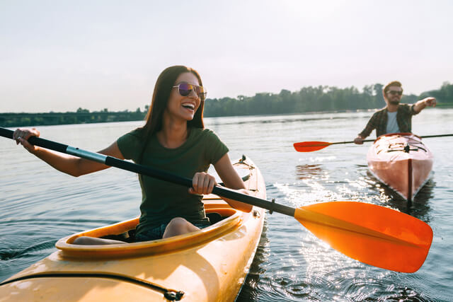 A couple canoeing on a lake