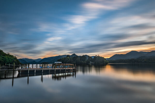 A view across the water at Derwentwater Marina at sunset