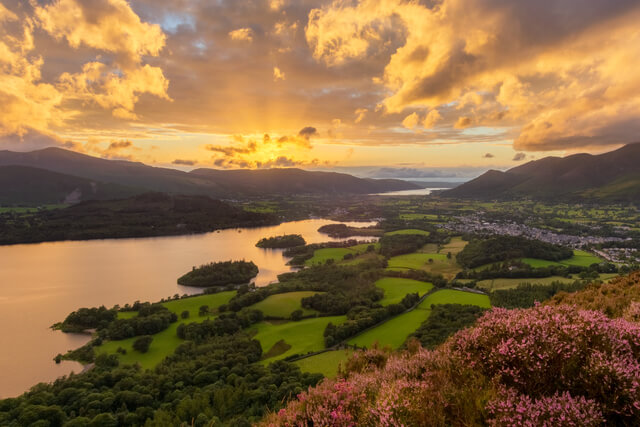 A scenic view over Derwentwater and surrounding hills