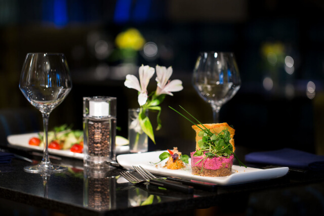 Food and wine glasses on a plate at Zeffirellis in Ambleside