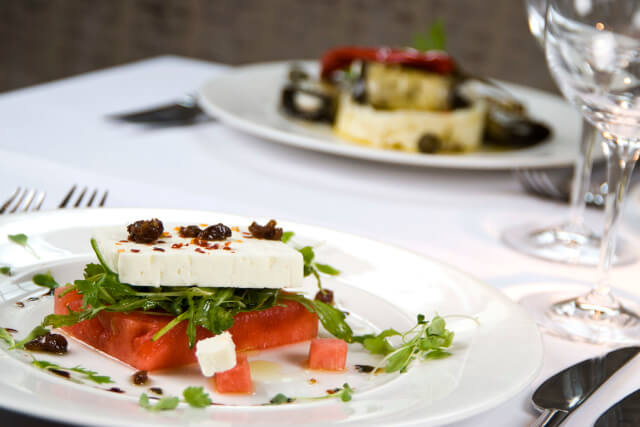 Two dishes on a table at Fellinis