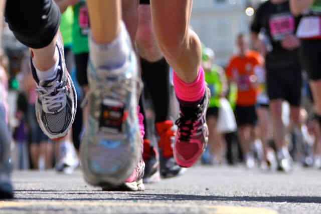 A low shot of runners shoes mid run