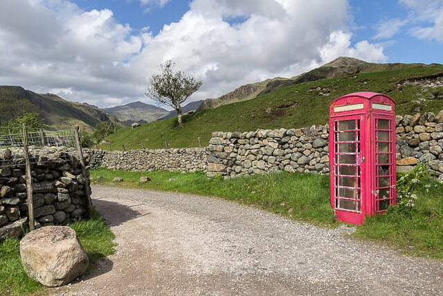 A red telephone box at the junction of Hardknott Pass