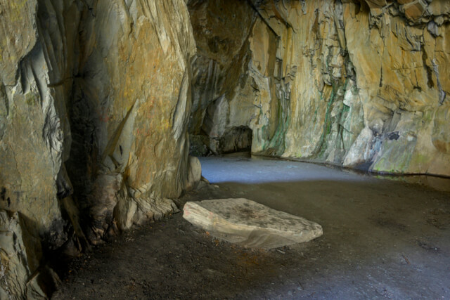 A tunnel enveloped in slate walls at Cathedral Cave