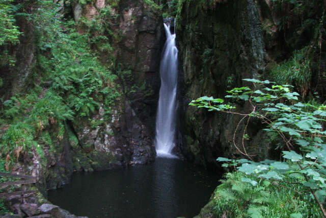 Stanley Ghyll Force waterfall cascading down a rockface into a pool of water