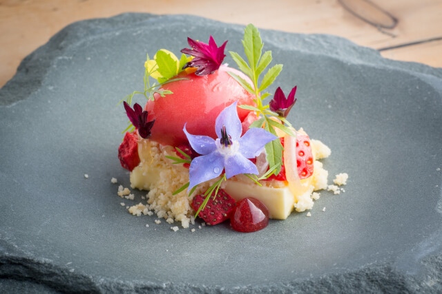 A small colourful meal on a slate plate at The Forest Side Grasmere