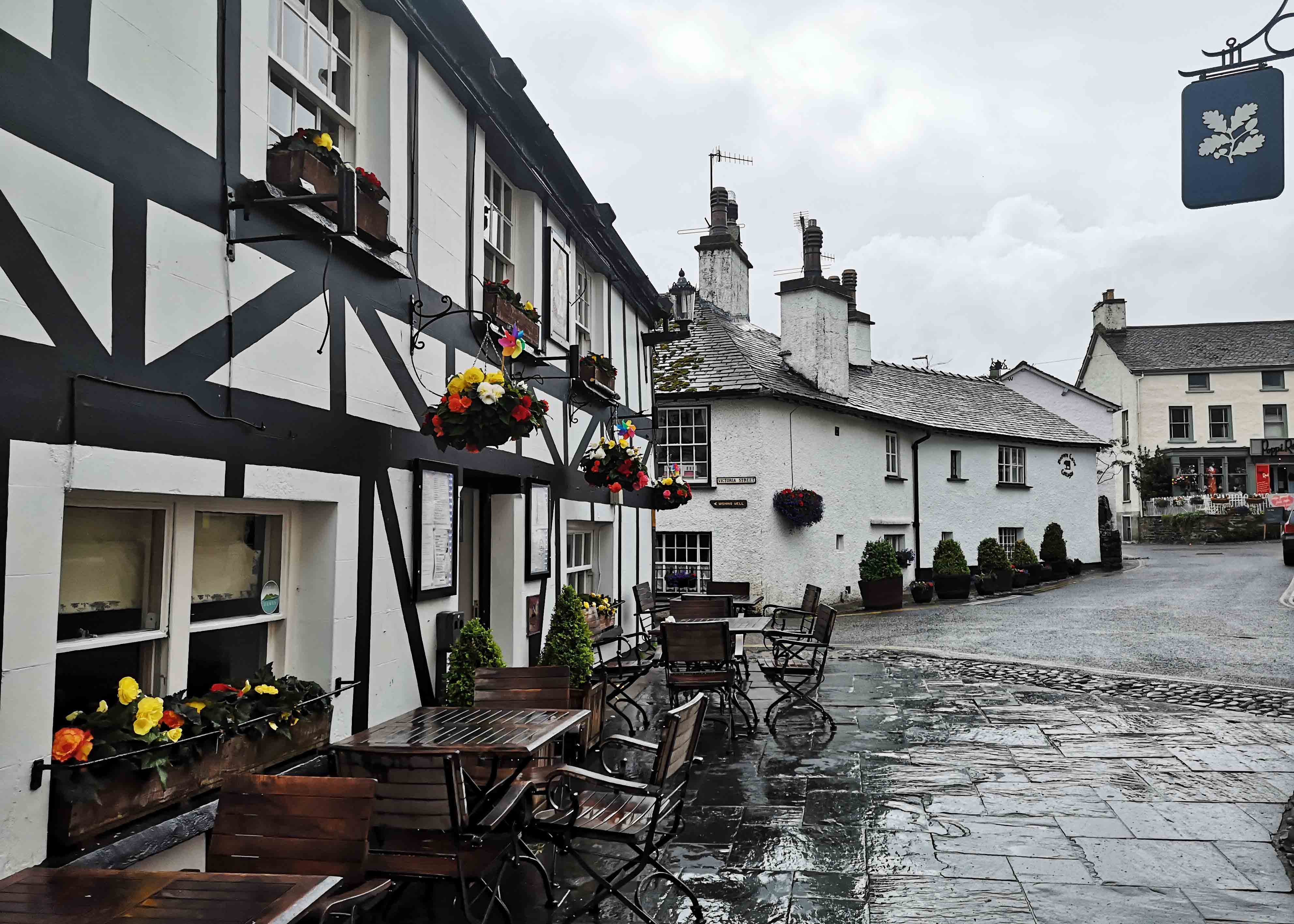 Lake District traditional village with flowers and cobbled streets