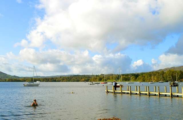 Windermere Lake with boats and a person.